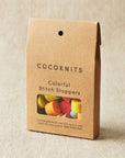 Cocoknits colorful stitch stoppers packaging on a beige background