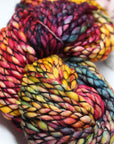 Multicolored skein of yarn on a white background