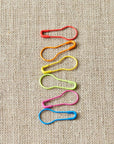 Cocoknits colorful stitch markers on a linen background
