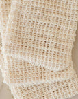 Overlapping agave soap bags showing the textured woven fiber