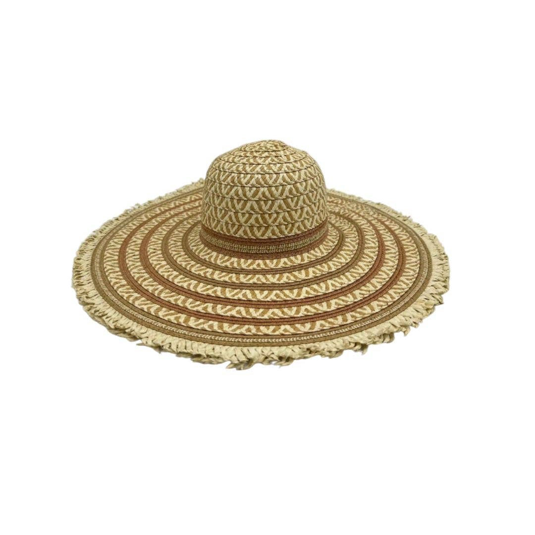 Wide-brimmed straw hat with decorative pattern on a white background