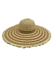Wide-brimmed straw hat with decorative pattern on a white background