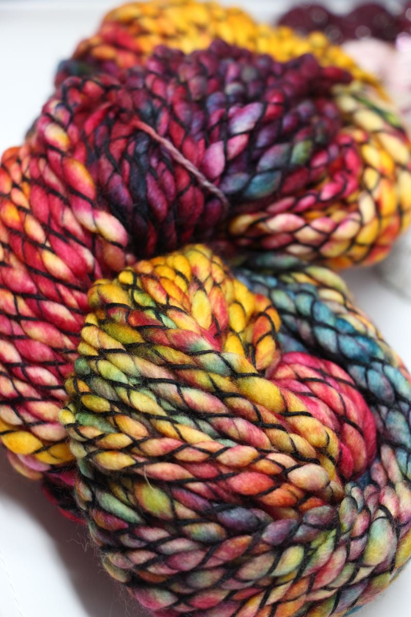 Multicolored skein of yarn on a white background