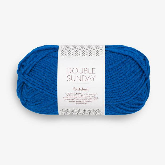 Blue skein of yarn with a label on a white background